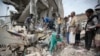 FILE - People inspect the rubble of houses destroyed by Saudi-led airstrikes in Sanaa, Yemen, Aug. 25, 2017. Airstrikes by a Saudi-led coalition targeted Yemen's capital early Friday, hitting at least three houses in Sanaa and killing dozens of civilians, including women and children, residents and eyewitnesses said. 