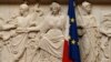 FILE - A French flag is seen alongside a European Union flag at the National Assembly in Paris, France, June 28, 2016.