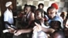 Rushing to buy bread as wheat runs short and food prices rise in Mozambique.