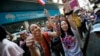 Anti-government protesters cheer during a march through Bangkok, Thailand, Feb. 3, 2014. 