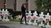 A woman reacts at a makeshift memorial outside the Tree of Life synagogue following Saturday's shooting at the synagogue in Pittsburgh, Oct. 29, 2018. 