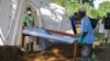 FILE - Doctors Without Borders (MSF) staff set up a cholera treatment field camp in Longo, 15 km from Bangui, Central African Republic, Aug. 16, 2016. 
