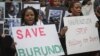 Burundi nationals from across the U.S. and Canada, along with supporters, demonstrate outside U.N. headquarters, calling for an end to political atrocities and human rights violations in Burundi, April 26, 2016.
