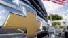 FILE - The Chevrolet logo is displayed at Miami Lakes AutoMall in Miami Lakes, Fla., Oct. 1, 2014. 