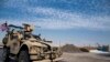 In this Oct. 28, 2019 photo, U.S. forces patrol Syrian oil fields. The Pentagon is increasing U.S. efforts to protect Syria's oil fields from the extremist group as well as from Syria itself and the country's Russian allies. 