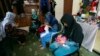 FILE - Victims of violence sew at a shelter operated by the Humanitarian Assistance for the Women and Children of Afghanistan, an NGO, in Kabul, Afghanistan, April 5, 2017. 