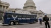 An Air Force bus waits on the Capitol plaza after President Donald Trump used his executive power to deny military aircraft to House Speaker Nancy Pelosi just before she was depart to visit troops abroad, on Capitol Hill in Washington, Jan. 17, 2019.