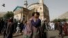 Afghans greet each other outside the Shah-e Doh Shamshira Mosque, on the first day of Eid al-Fitr, which marks the end of the holy month of Ramadan, in Kabul, Afghanistan, June 15, 2018.