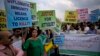 FILE - Pakistani protesters stage a rally demanding a trial for American diplomat involved in a vehicle crash that killed a person, in Islamabad, Pakistan, April 10, 2018.