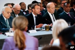 UN Special Envoy for Libya Ghassan Salame, French President Macron, French Foreign Affairs Minister Le Drian and Congo President Denis Sassou Nguesso, attend an International Conference on Libya at the Elysee Palace in Paris, May 29, 2018.