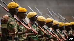 Members of the Zimbabwean military parade during a dress rehearsal for Friday's presidential inauguration of Emmerson Mnangagwa, at the National Sports Stadium in Harare, Zimbabwe, Nov. 23, 2017.