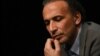 FILE - This file photo taken on March 26, 2016 shows Swiss Islamologist Tariq Ramadan taking part in a conference on the theme "Live together" in Bordeaux.