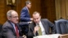 Sen. Jim Risch, R-Idaho (L) and Sen. Mike Lee, R-Utah, confer on Capitol Hill in Washington, Jan. 8, 2015, as the Senate Energy and Natural Resources Committee gathered for a markup on the long-stalled Keystone XL pipeline bill.