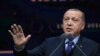 FILE - Turkey's President Recep Tayyip Erdogan speaks in Ankara, March 19, 2018. Erdogan has said that candidates deemed sympathetic to the PKK who win in the March 2019 local elections will be removed.