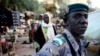 A Timbutku policeman patrols a central market where Al Qaeda three years ago was smuggling cocaine to Europe. The Africa Union’s Mission to Mali and the Sahel is consulting on increased cooperation among security forces of neighboring countries.