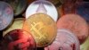 FILE - Representations of cryptocurrencies are seen in this illustration picture taken June 2, 2021. 