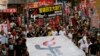 June 4 marks the 25th anniversary of China's bloody crackdown on Tiananmen Square. Thousands of people march on a downtown street in Hong Kong, June 1, 2014. 