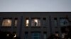 FILE - A worker looks out a window inside Pakistan's embassy in Washington, Nov. 5, 2007.