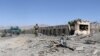 FILE - Afghan security forces inspect the aftermath of a suicide bomb blast in Gardez, Paktia Province, Afghanistan, June 18, 2017. 