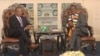 U.S. Ambassador to Zimbabwe Brian Nichols, left, speaks with Zimbabwe President Emmerson Mnangagwa at the State House in Harare, Aug. 15, 2018. 