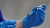 A nurse prepares to administer the Pfizer-BioNTech COVID-19 vaccine at Guy's Hospital in London, Britain December 8, 2020. Frank Augstein/Pool via REUTERS/File Photo