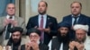 FILE - Taliban officials pray during intra-Afghan talks in Moscow, Feb. 6, 2019. Negotiations between the Afghan Taliban and the United States are to resume Monday in Qatar.