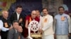 Tibetan spiritual leader the Dalai Lama presents a memento to Junior Indian Culture Minister Mahesh Sharma, second right, as he arrives to attend an event marking the beginning of the 60th year of the Dalai Lama's exile in India, in Dharmsala, India, Marc