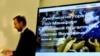 FILE - Member of Ukraine's parliament and former journalist Serhiy Leshchenko holds papers in front of a screen displaying a picture of Donald Trump's former presidential campaign chairman Paul Manafort during a press conference in Kyiv, Ukraine, Aug. 19, 2016.