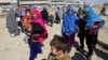 Afghan families fleeing from the districts of Malistan and Jaghori, because of the conflict between Taliban and Afghan forces, arrive in Ghazni, Afghanistan, Nov. 14, 2018. 