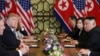 North Korea's leader Kim Jong Un and U.S. President Donald Trump look on during the extended bilateral meeting in the Metropole hotel during the second North Korea-U.S. summit in Hanoi, Vietnam, Feb. 28, 2019. 
