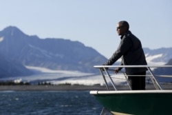 FILE - U.S. President Barack Obama views Bear Glacier on a boat tour of Kenai Fjords National Park in Seward, Alaska, Sept. 1, 2015.