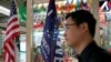 FILE - A flag of the U.S. President Donald Trump's "Keep America Great!" 2020 re-election campaign and the U.S. flag are seen in a flag stall at the Yiwu Wholesale Market in Yiwu, Zhejiang province, China, May 10, 2019. 