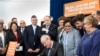In this photo provided by the New Jersey Governor's Office, Gov. Phil Murphy, center, signs several gun safety bills at the Richard J. Hughes Justice Complex Atrium in Trenton, N.J., June 13 , 2018. 