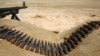FILE - Bullets lie next to a gun at a Sinjar Resistance Units (YBS) check point, a militia affiliated with the Kurdistan Workers' Party (PKK), in the village of Umm al-Dhiban, northern Iraq, April 30, 2016. Fears are growing the mountainous region is becoming the focal point of a proxy conflict between the Iraqi Kurdistan Democratic Party (KDP) annd PKK-backed forces.