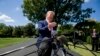 President Donald Trump speaks with reporters before departing on Marine One on the South Lawn of the White House, Aug. 21, 2019, in Washington. 