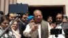 FILE - Pakistan's former Prime Minister Nawaz Sharif talks to media after appearing before the accountability court to face the corruption references filed against him, in Islamabad, Pakistan, April 17, 2018. 