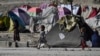 FILE - Internally displaced Afghan children play at the Saray Shamali IDP camp in Kabul, Afghanistan, Nov. 2, 2021. 