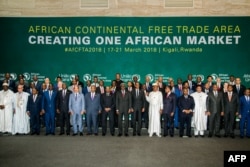 FILE - The African Heads of States and Governments pose during the African Union Summit for the agreement to establish the African Continental Free Trade Area in Kigali, Rwanda, March 21, 2018.