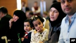 FILE - Syrian refugees attend the launch of an education program in Ankara, Turkey, June 8, 2017. Turkey, the European Union and UNICEF formally launched an EU-funded project to encourage Syrians and other refugees in Turkey to enroll their children in schools.