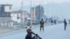 FILE - Afghan National Army soldiers keep watch near the site of a blast in Jalalabad, Afghanistan, Feb. 11, 2021.