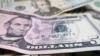 FILE - U.S. banknotes are shown in an illustration photo taken in New York, June 6, 2018.