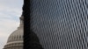 The U.S. Capitol dome is seen behind a security fence in Washington, Jan. 11, 2021. 