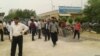 Farmers from the town of Bavi in southwestern Iran's Khuzestan province rally outside a municipal building in Ahvaz to protest water shortages, April 23, 2018 .