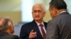 FILE - India's Foreign Minister Salman Khurshid speaks to his staff as they attend the 46th Association of Southeast Asian Nations (ASEAN) Foreign Ministers Meeting in Bandar Seri Begawan, July 1, 2013.