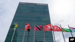 FILE - Member state flags fly outside the United Nations headquarters, Sept. 18, 2020, in New York. 
