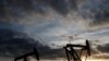 Oil pumps are seen at sunset outside Vaudoy-en-Brie, near Paris, France April 23, 2018. REUTERS/Christian Hartmann