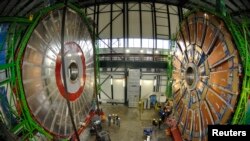 Overview of the first element (L) of the huge magnet of the CMS (Compact Muon Solenoid) experimental site at the European Organization for Nuclear Research CERN (Centre Europeen de Recherche Nucleaire) before its lowering on Thursday in the French village