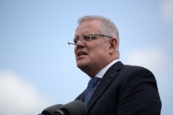FILE - Australian Prime Minister Scott Morrison speaks during a joint press conference held with New Zealand Prime Minister Jacinda Ardern at Admiralty House in Sydney, Australia, Feb. 28, 2020.