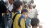 FILE - Authorities say children and wives of IS fighters are considered civilians, but other Mosul families often shun them. (H.Murdock/VOA)