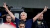FILE - Long-time friend of President Donald Trump Roger Stone flashes victory signs after his appearance at Federal Court in Fort Lauderdale, Florida, Jan. 25, 2019.